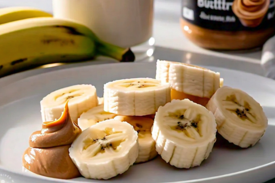 A sliced banana on a plate with a jar of peanut butter and a glass of milk in the background.